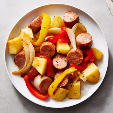 A steaming pot of 1-Pot Kielbasa and Potato Bake, promising a warm, savory family dinner.