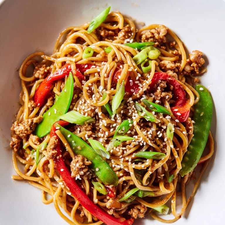 Savory Sesame Hoisin Ground Chicken Pasta, a delicious fusion with tender chicken and bright vegetables.